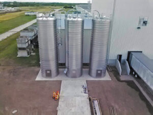 Three large sprial silos outisde the plant