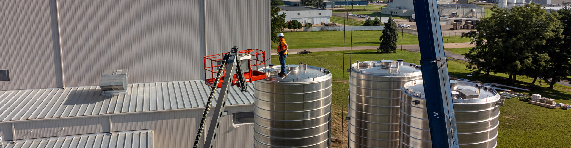 Schake Slider of a man standing on a silo